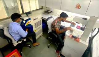 Technicians operating laser welding and marking machines at Millennium Jewellery